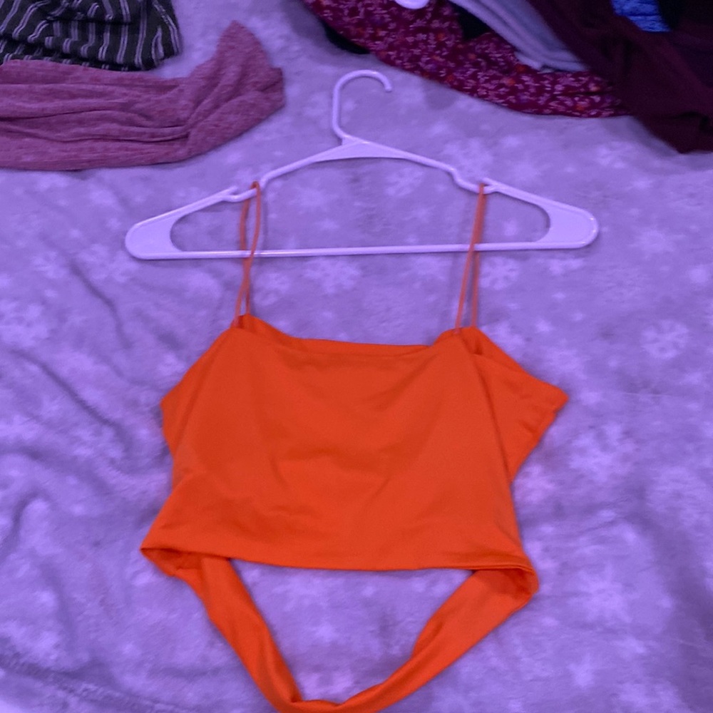 This cute orange crop top shirt is from SHEIN it’s a size small